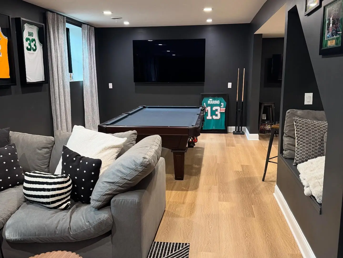 Lower-level game room with billiards table