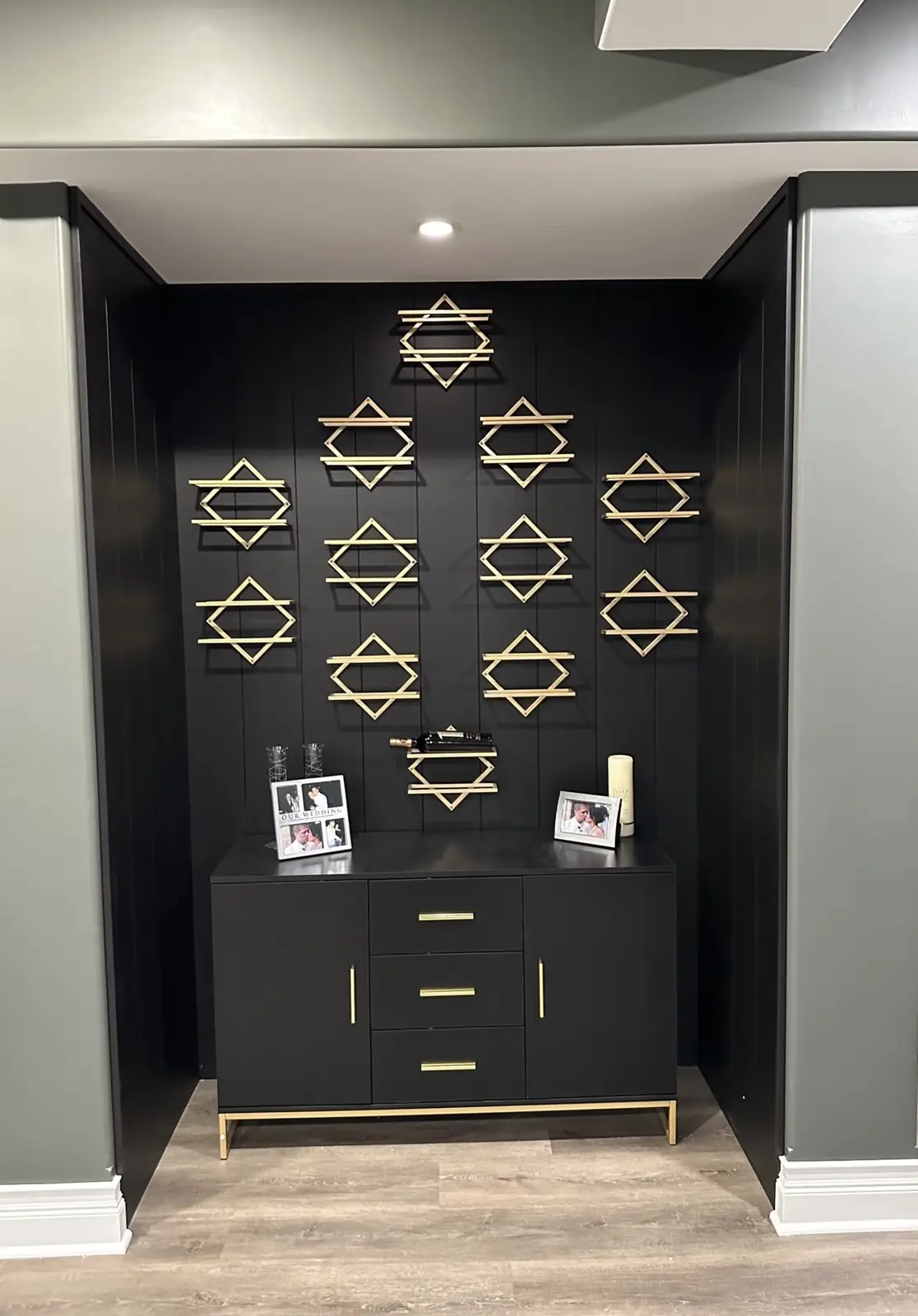 Bar alcove with black shiplap and gold geometric wine racks — Brookstone