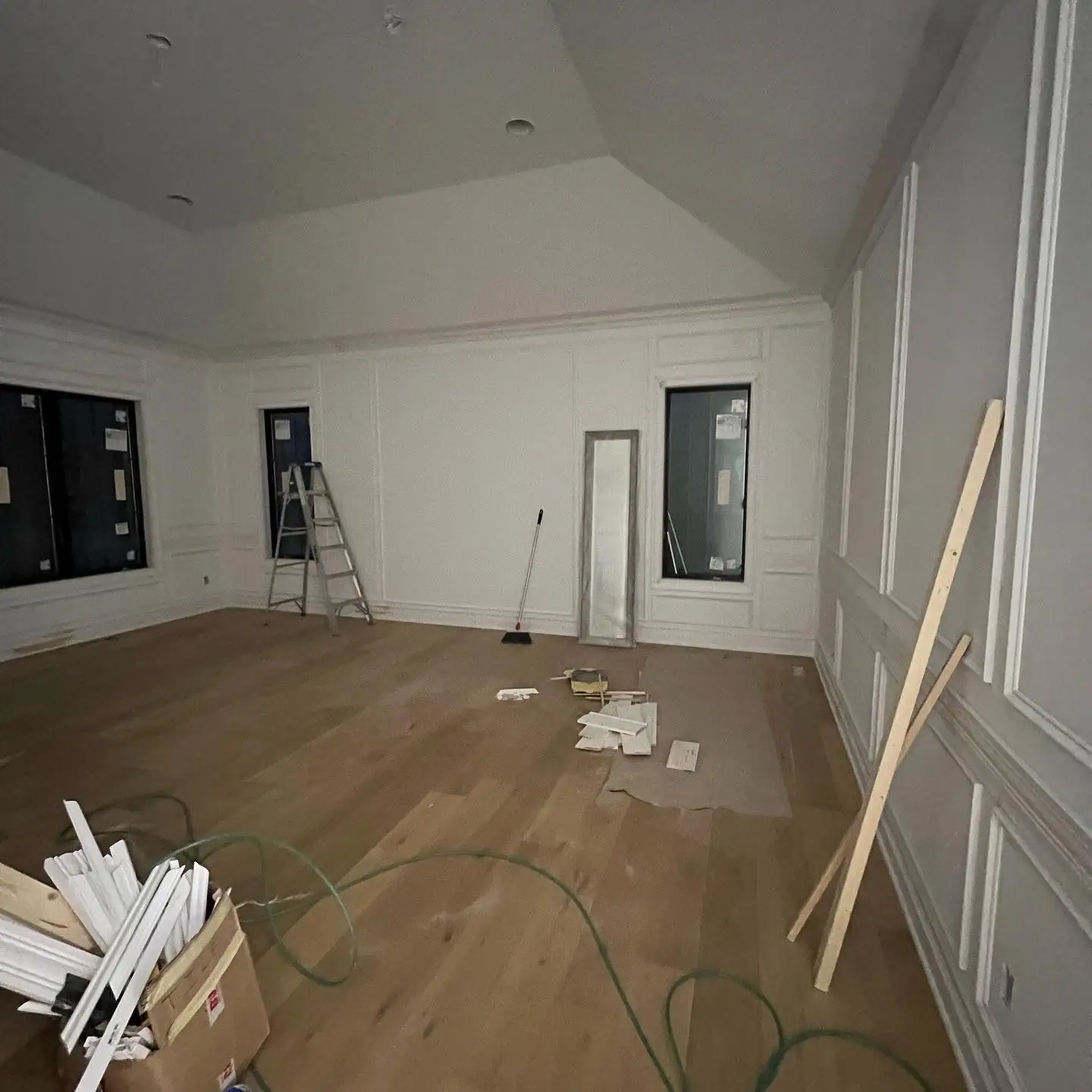 Primary bedroom with wall moulding going in and oak floors down