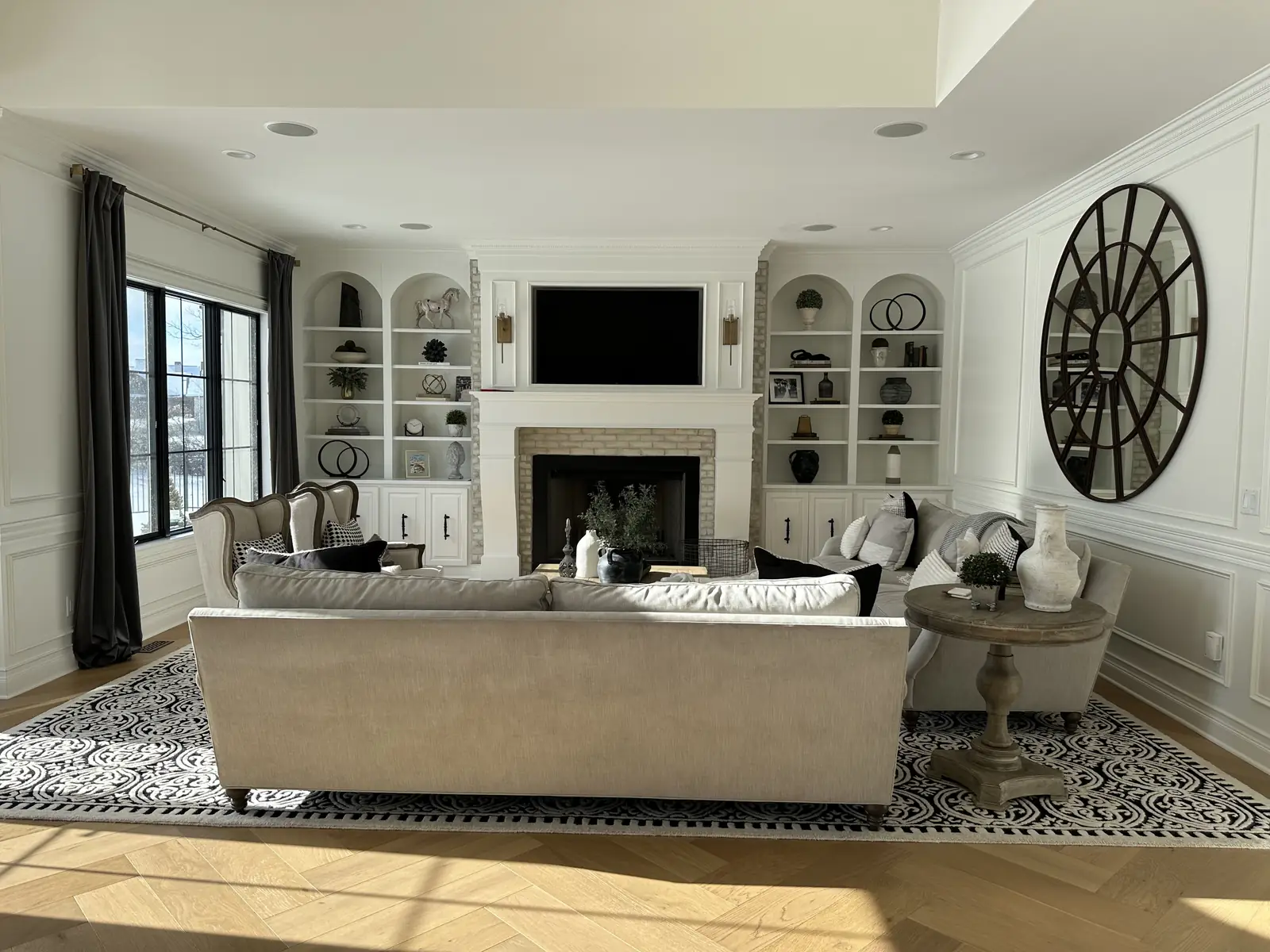 Living room with arched built-ins — French-Inspired Residence