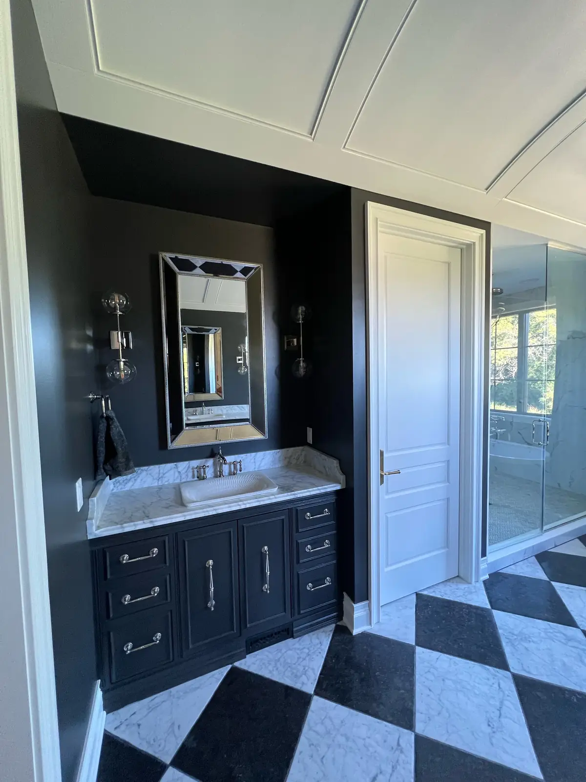 Vanity and doorway in the primary bath
