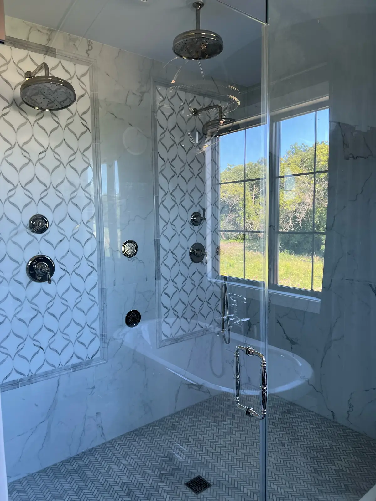 Glass shower with marble walls — French-Inspired Residence