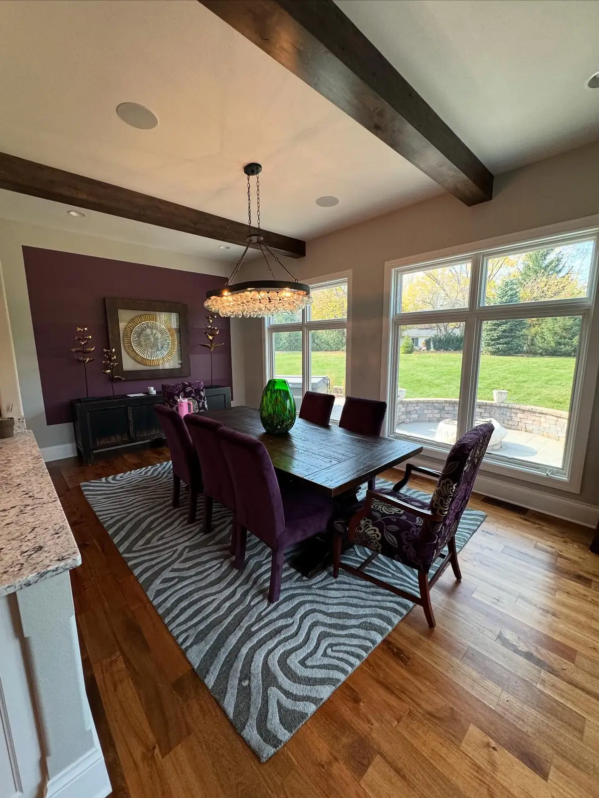 Dining room before — purple chairs and dark rug