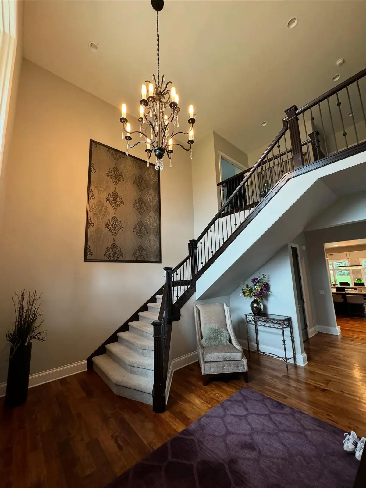 Staircase before — purple rug and artwork