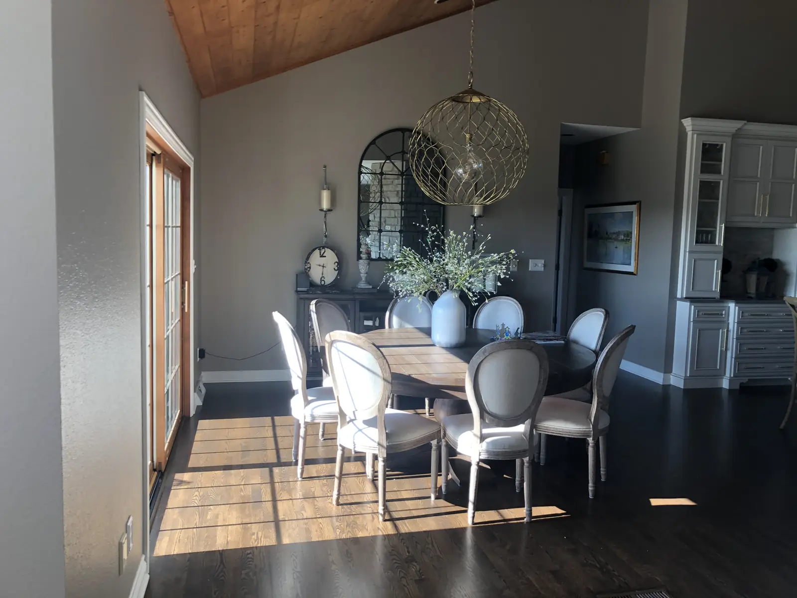 Dining room with a gold orb pendant — Ridgefield Remodel