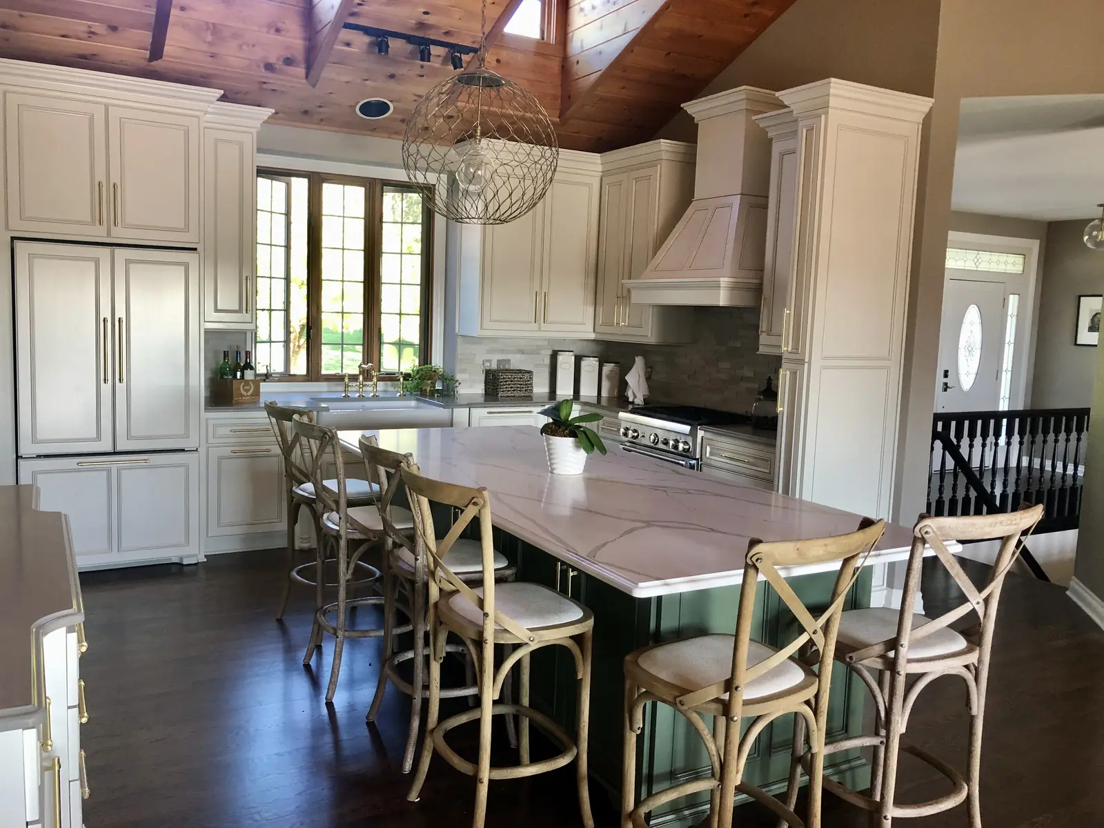 White cabinetry and a green island beneath a cedar ceiling — Ridgefield Remodel