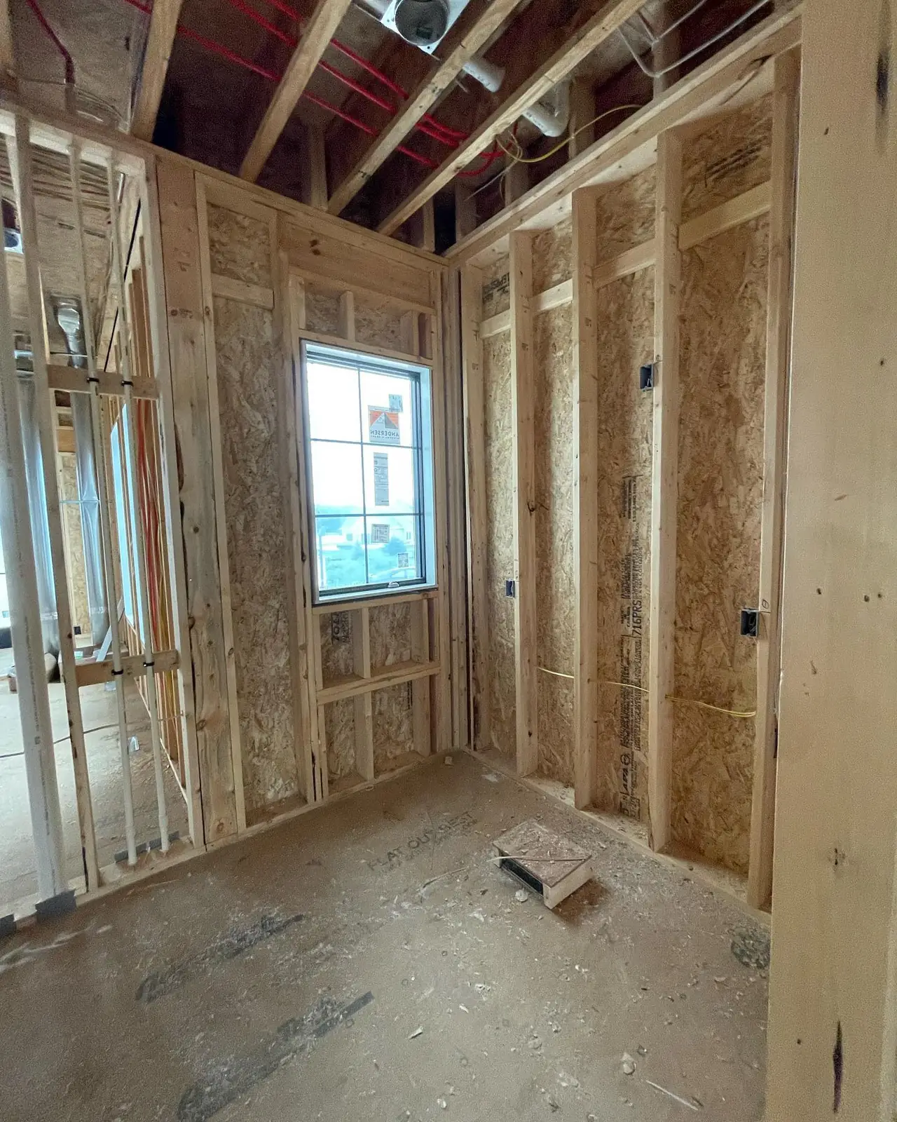 Laundry room before — framing, looking toward the window