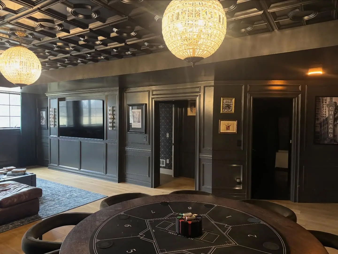 Speakeasy with framed art and dark paneling